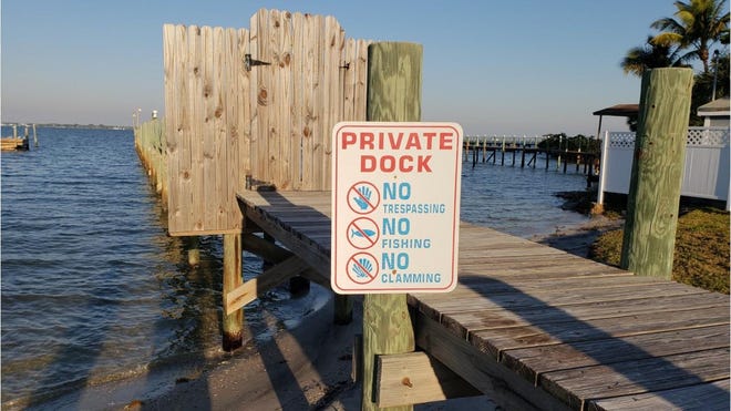 Who posted No Fishing sign on Florida causeway?