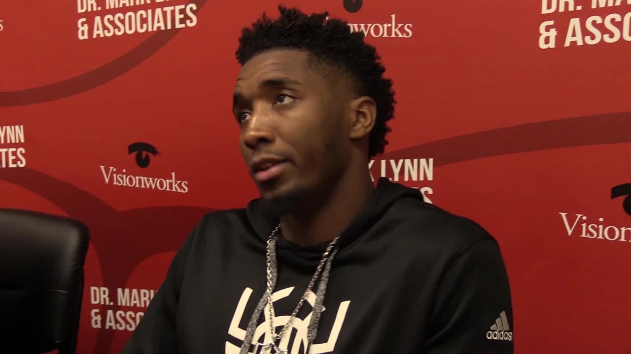 Donovan Mitchell supports cards with Louisville shoes