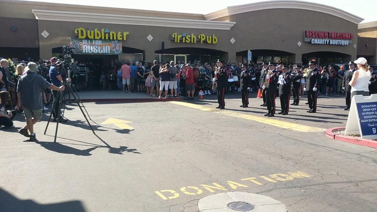 Goodyear firefighter Austin Peck serenades his own memorial service